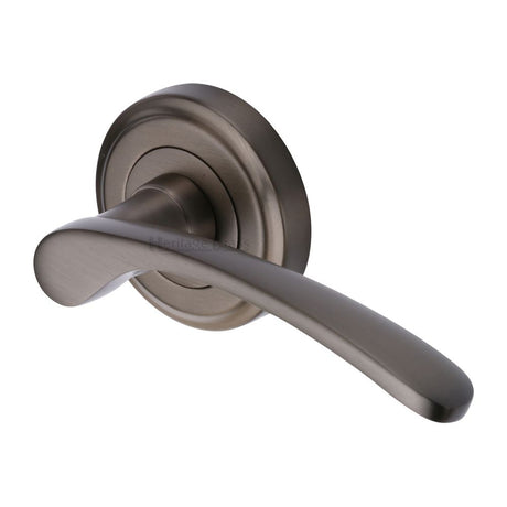 This is an image of a Heritage Brass - Door Handle Lever Latch on Round Rose Sophia Design Matt Bronze, v1900-mb that is available to order from Trade Door Handles in Kendal.