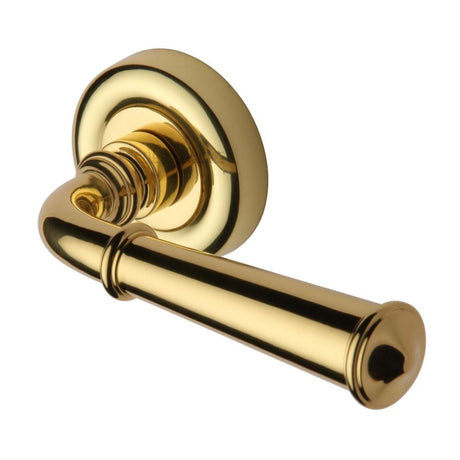 This is an image of a Heritage Brass - Door Handle Lever Latch on Round Rose Colonial Design Polished Bras, v1932-pb that is available to order from Trade Door Handles in Kendal.