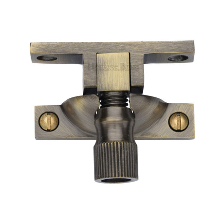 This is an image of a Heritage Brass - Narrow Brighton Sash Fastener Antique Brass finish, v2054-at that is available to order from Trade Door Handles in Kendal.