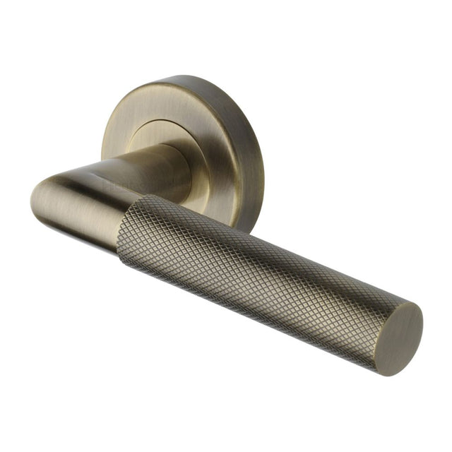 This is an image of a Heritage Brass - Door Handle Lever Latch on Round Rose Bauhaus Mitre Knurled Des, v2272-at that is available to order from Trade Door Handles in Kendal.