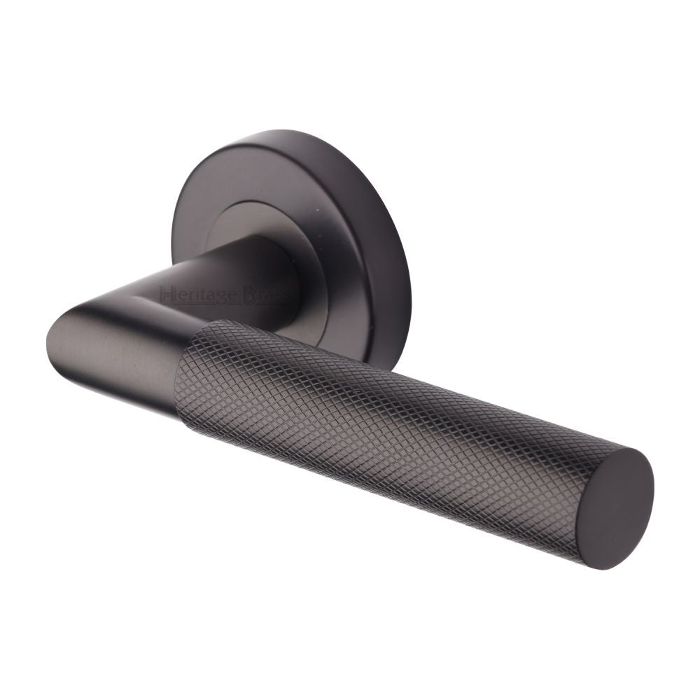 This is an image of a Heritage Brass - Door Handle Lever Latch on Round Rose Bauhaus Mitre Knurled Des, v2272-mb that is available to order from Trade Door Handles in Kendal.