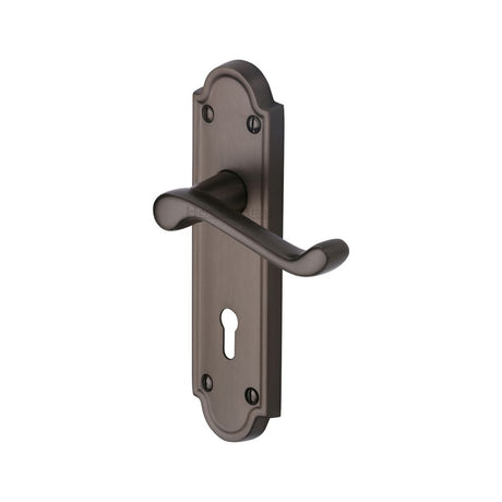This is an image of a Heritage Brass - Door Handle Lever Lock Meridian Design Matt Bronze Finish, v300-mb that is available to order from Trade Door Handles in Kendal.