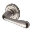 This is an image of a Heritage Brass - Door Handle Lever Latch on Round Rose Charlbury Design Satin Nic, v3020-sn that is available to order from Trade Door Handles in Kendal.