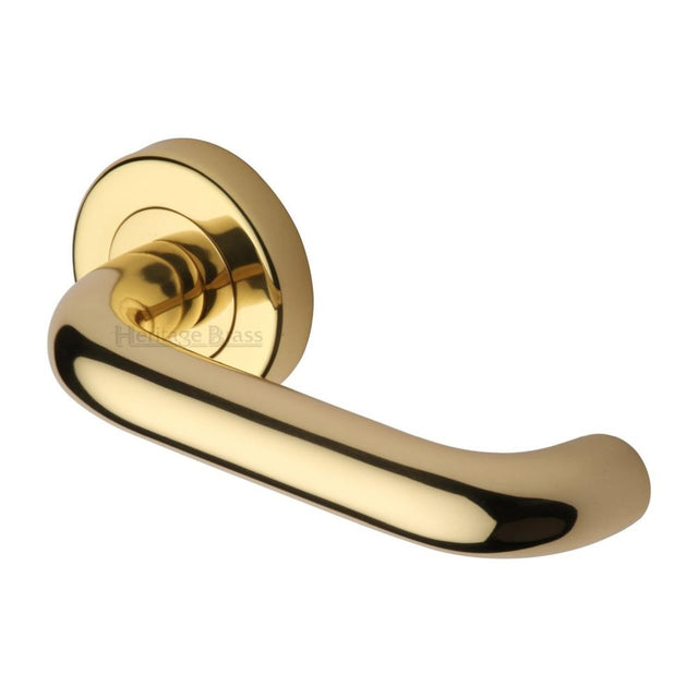 This is an image of a Heritage Brass - Door Handle Lever Latch on Round Rose Harmony Design Polished Brass, v3090-pb that is available to order from Trade Door Handles in Kendal.