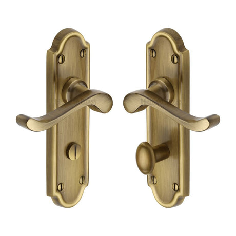 This is an image of a Heritage Brass - Door Handle for Bathroom Meridian Design Antique Brass Finish, v330-at that is available to order from Trade Door Handles in Kendal.