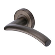 This is an image of a Heritage Brass - Door Handle Lever Latch on Round Rose Centaur Design Matt Bronz, v3490-mb that is available to order from Trade Door Handles in Kendal.