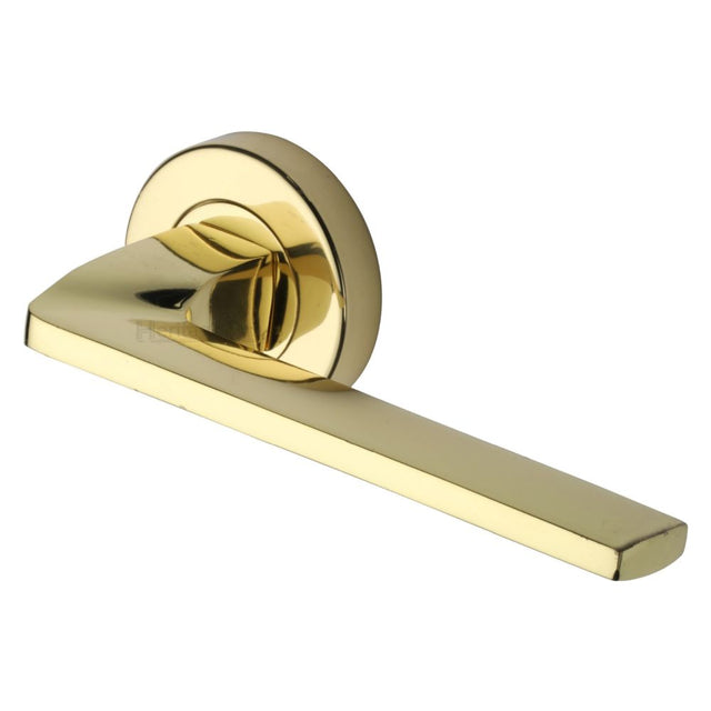 This is an image of a Heritage Brass - Door Handle Lever Latch on Round Rose Metro Angled Design Polished, v3790-pb that is available to order from Trade Door Handles in Kendal.