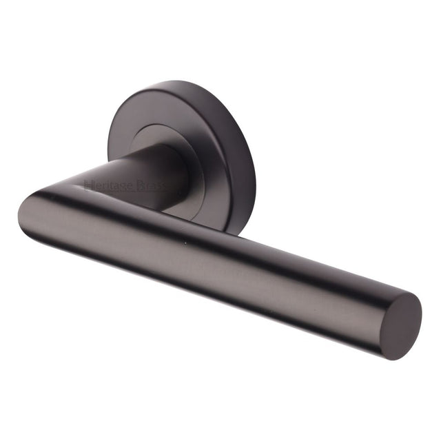 This is an image of a Heritage Brass - Door Handle Lever Latch on Round Rose Athena Design Matt Bronze, v3840-mb that is available to order from Trade Door Handles in Kendal.