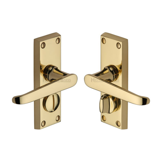 This is an image of a Heritage Brass - Door Handle for Privacy Set Victoria Short Design Polished Brass Fi, v3935-pb that is available to order from Trade Door Handles in Kendal.