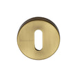 This is an image of a Heritage Brass - Key Escutcheon Antique Brass Finish, v4007-at that is available to order from Trade Door Handles in Kendal.