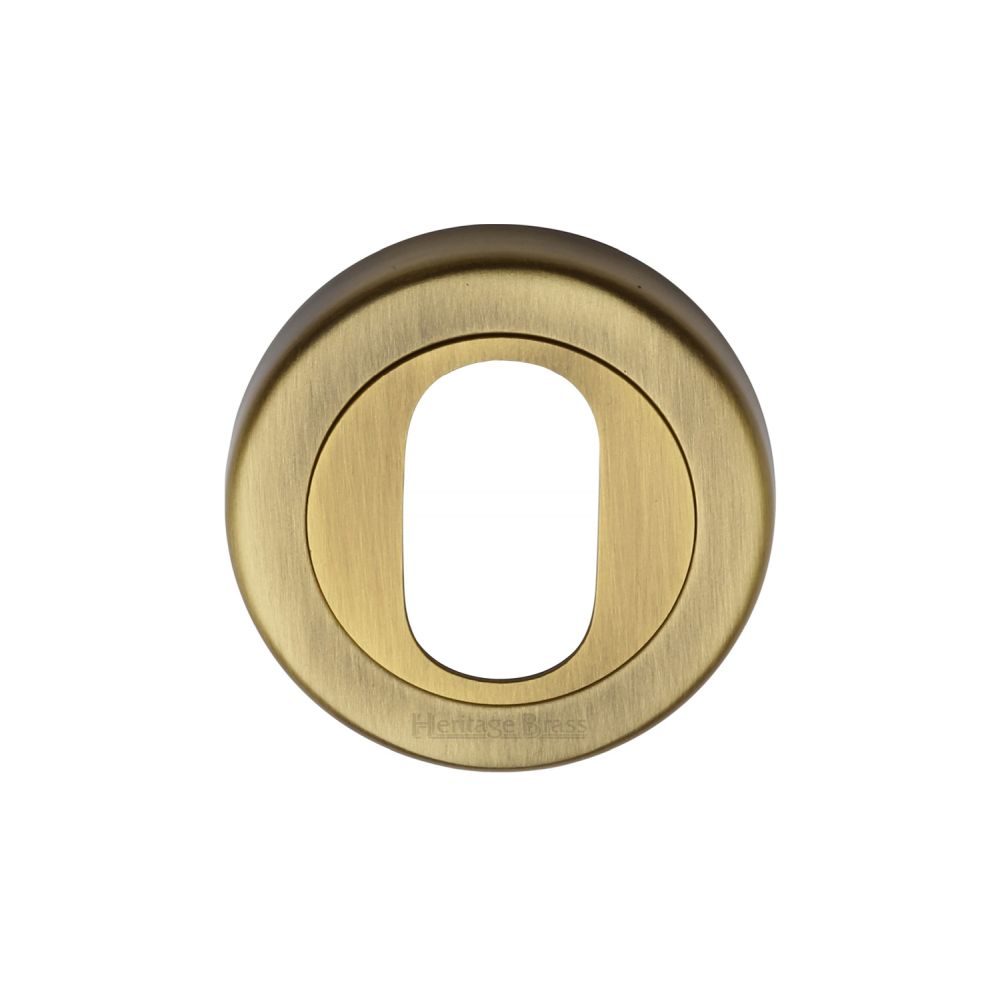 This is an image of a Heritage Brass - Oval Profile Cylinder Escutcheon Antique Brass Finish, v4010-at that is available to order from Trade Door Handles in Kendal.