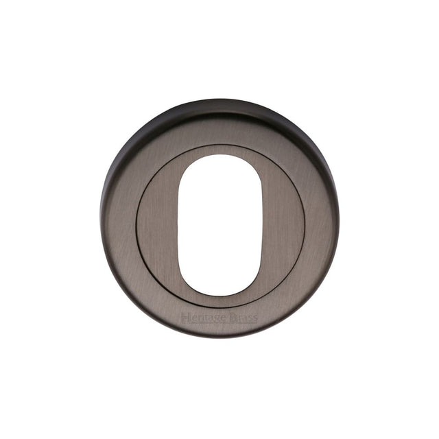 This is an image of a Heritage Brass - Oval Profile Cylinder Escutcheon Matt Bronze Finish, v4010-mb that is available to order from Trade Door Handles in Kendal.