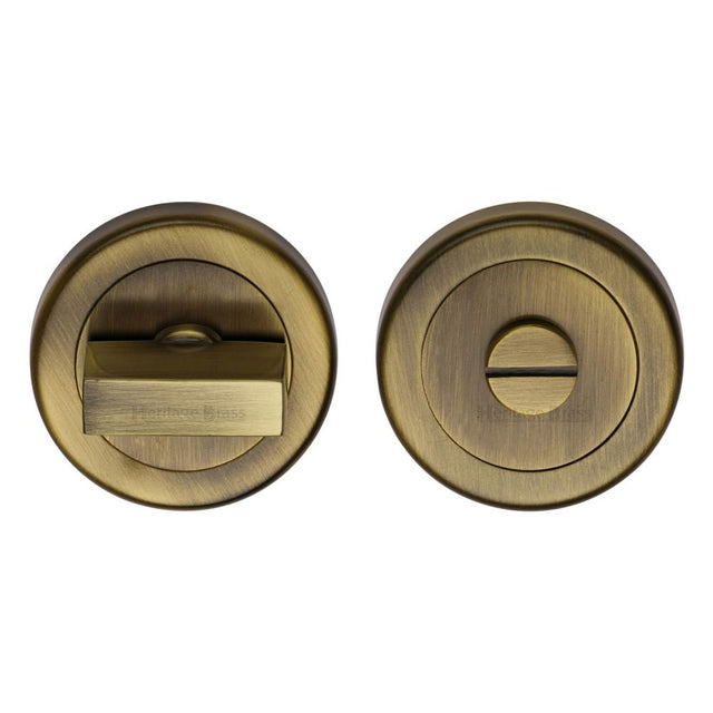 This is an image of a Heritage Brass - Thumbturn & Emergency Release Antique Brass Finish, v4035-at that is available to order from Trade Door Handles in Kendal.