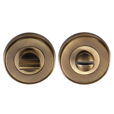 This is an image of a Heritage Brass - Thumbturn & Emergency Release Antique Brass Finish, v4045-at that is available to order from Trade Door Handles in Kendal.