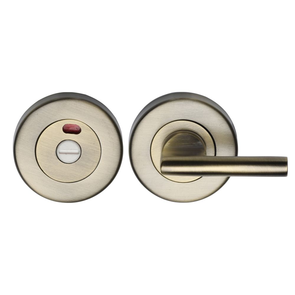 This is an image of a Heritage Brass - Indicator Turn & Release for Bathroom Doors Antique Brass Finish, v4048-at that is available to order from Trade Door Handles in Kendal.