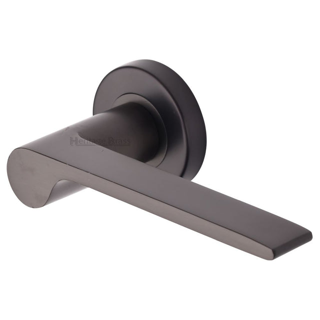 This is an image of a Heritage Brass - Door Handle Lever Latch on Round Rose Julia Design Matt Bronze, v4190-mb that is available to order from Trade Door Handles in Kendal.