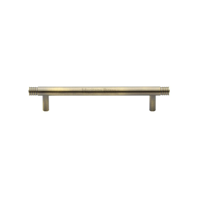 This is an image of a Heritage Brass - Cabinet Pull Contour Design 128mm CTC Antique Brass Finish, v4446-128-at that is available to order from Trade Door Handles in Kendal.