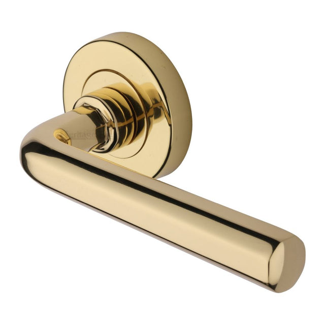 This is an image of a Heritage Brass - Door Handle Lever Latch on Round Rose Octave Design Polished Brass, v4545-pb that is available to order from Trade Door Handles in Kendal.