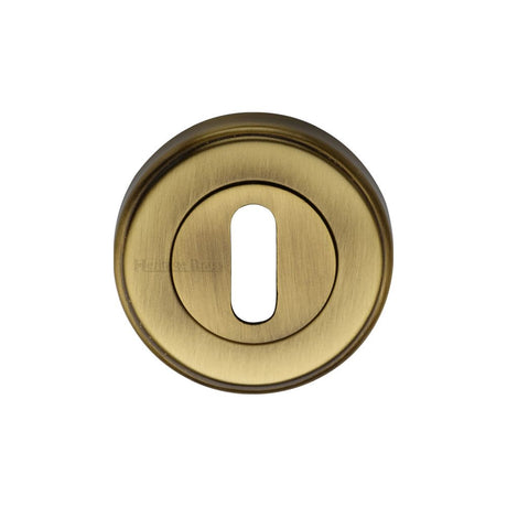 This is an image of a Heritage Brass - Key Escutcheon Antique Brass Finish, v5000-at that is available to order from Trade Door Handles in Kendal.