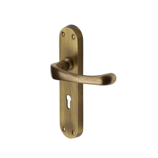 This is an image of a Heritage Brass - Door Handle Lever Lock Gloucester Design Antique Brass Finish, v6050-at that is available to order from Trade Door Handles in Kendal.