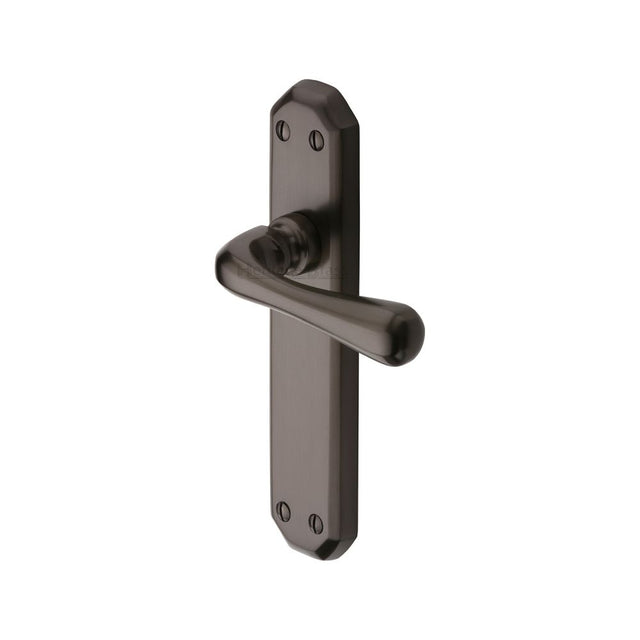 This is an image of a Heritage Brass - Door Handle Lever Latch Charlbury Design Matt Bronze Finish, v7060-mb that is available to order from Trade Door Handles in Kendal.