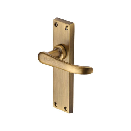 This is an image of a Heritage Brass - Door Handle Lever Latch Windsor Design Antique Brass Finish, v713-at that is available to order from Trade Door Handles in Kendal.