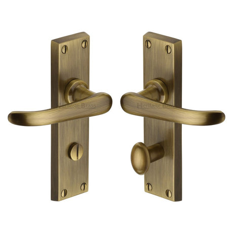 This is an image of a Heritage Brass - Door Handle for Bathroom Windsor Design Antique Brass Finish, v730-at that is available to order from Trade Door Handles in Kendal.