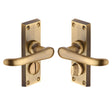 This is an image of a Heritage Brass - Door Handle for Privacy Set Windsor Short Design Antique Brass Fin, v735-at that is available to order from Trade Door Handles in Kendal.