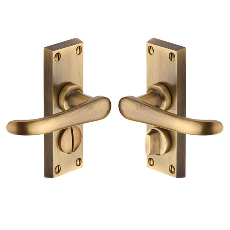 This is an image of a Heritage Brass - Door Handle for Privacy Set Windsor Short Design Antique Brass Fin, v735-at that is available to order from Trade Door Handles in Kendal.