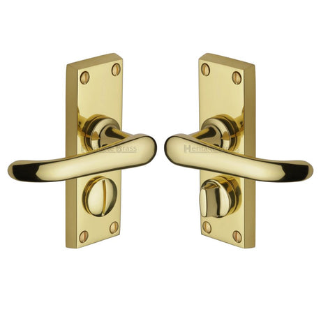 This is an image of a Heritage Brass - Door Handle for Privacy Set Windsor Short Design Polished Brass Fin, v735-pb that is available to order from Trade Door Handles in Kendal.