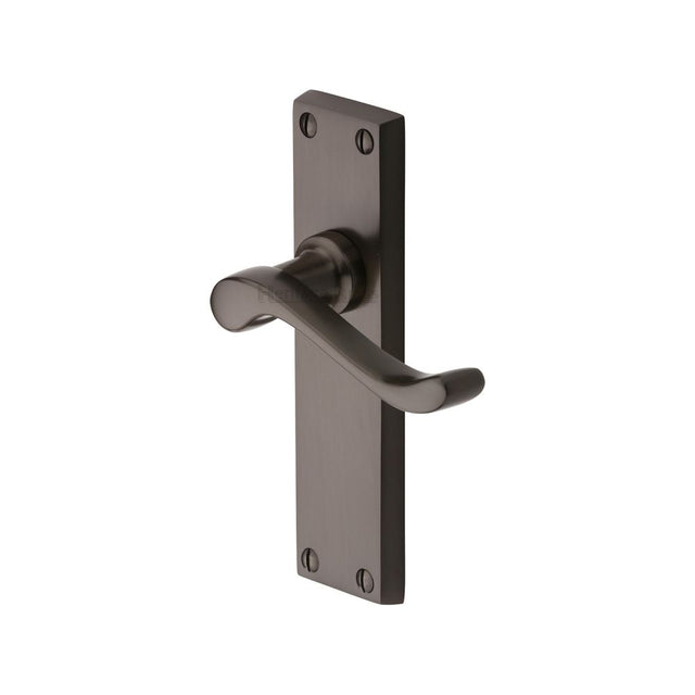 This is an image of a Heritage Brass - Door Handle Lever Latch Bedford Design Matt Bronze Finish, v803-mb that is available to order from Trade Door Handles in Kendal.