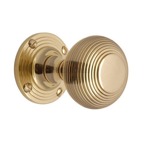 This is an image of a Heritage Brass - Mortice Knob on Rose Reeded Design Polished Brass Finish, v971-pb that is available to order from Trade Door Handles in Kendal.