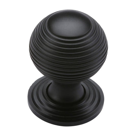 This is an image of a Heritage Brass - Cabinet Knob Reeded Design 32mm Matt Black Finish, v973-32-bkmt that is available to order from Trade Door Handles in Kendal.