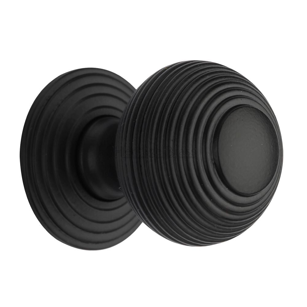 This is a image of a Heritage Brass - Cabinet Knob Reeded Design 38mm Matt Black Finish that is available to order from Trade Door Handles in Kendal