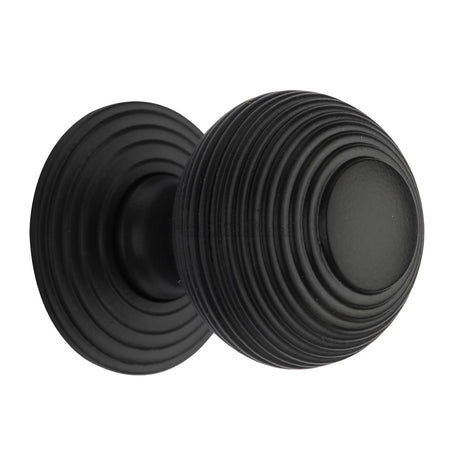 This is an image of a Heritage Brass - Cabinet Knob Reeded Design 38mm Matt Black Finish, v973-38-bkmt that is available to order from Trade Door Handles in Kendal.