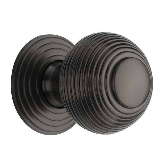 This is an image of a Heritage Brass - Cabinet Knob Reeded Design 38mm Matt Bronze Finish, v973-38-mb that is available to order from Trade Door Handles in Kendal.