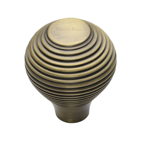 This is an image of a Heritage Brass - Cabinet Knob Reeded Design 32mm Antique Brass Finish, v974-32-at that is available to order from Trade Door Handles in Kendal.