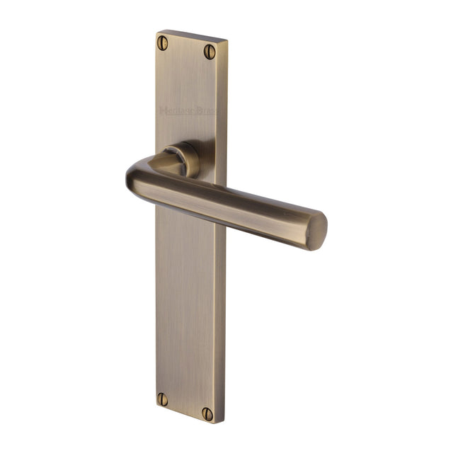 This is an image of a Heritage Brass - Octave Lever Latch Door Handle on 200mm Plate Antique Brass finish, vt5910-at that is available to order from Trade Door Handles in Kendal.