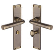 This is an image of a Heritage Brass - Octave Bathroom Set Door Handle on 200mm Plate Antique Brass finish, vt5930-at that is available to order from Trade Door Handles in Kendal.