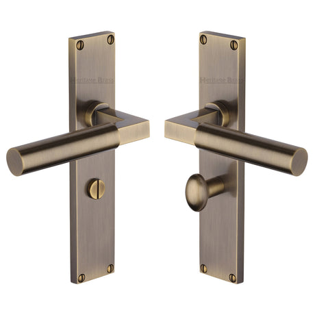 This is an image of a Heritage Brass - Bauhaus Bathroom Set Door Handle on 200mm Plate Antique Brass finish, vt6330-at that is available to order from Trade Door Handles in Kendal.