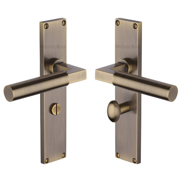 This is an image of a Heritage Brass - Bauhaus Bathroom Set Door Handle on 200mm Plate Antique Brass finish, vt6330-at that is available to order from Trade Door Handles in Kendal.