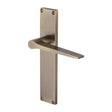 This is an image of a Heritage Brass - Gio Lever Latch Door Handle on 200mm Plate Antique Brass finish, vt8110-at that is available to order from Trade Door Handles in Kendal.