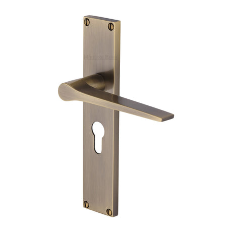 This is an image of a Heritage Brass - Gio Euro Profile Door Handle on 200mm Plate Antique Brass finish, vt8148-at that is available to order from Trade Door Handles in Kendal.