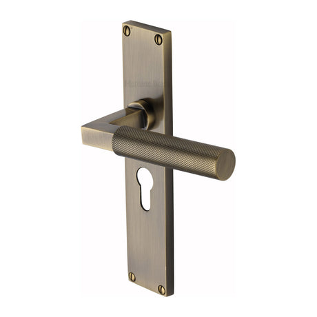 This is an image of a Heritage Brass - Bauhaus Knurled Euro Profile Door Handle on 200mm Plate Antique Brass finish, vt9348-at that is available to order from Trade Door Handles in Kendal.