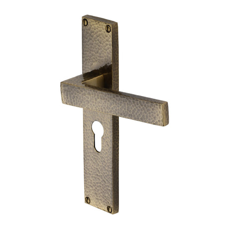 This is an image of a Heritage Brass - Delta Hammered Euro Profile Door Handle on 200mm Plate Antique Brass finish, vth3348-at that is available to order from Trade Door Handles in Kendal.