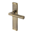 This is an image of a Heritage Brass - Bauhaus Hammered Lever Latch Door Handle on 200mm Plate Antique Brass finish, vth4310-at that is available to order from Trade Door Handles in Kendal.