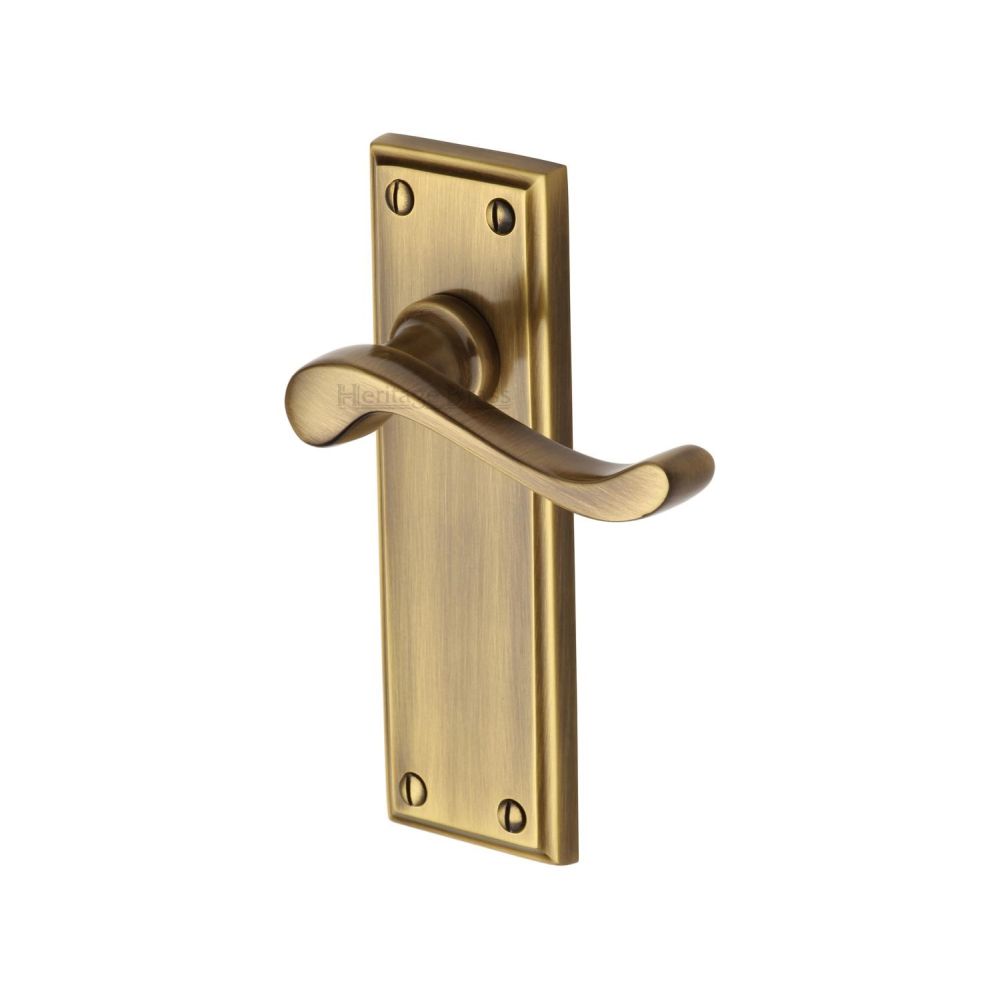 This is an image of a Heritage Brass - Door Handle Lever Latch Edwardian Design Antique Brass Finish, w3213-at that is available to order from Trade Door Handles in Kendal.