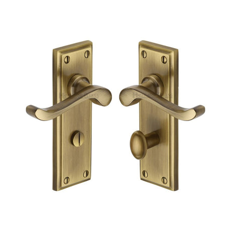 This is an image of a Heritage Brass - Door Handle for Bathroom Edwardian Design Antique Brass Finish, w3220-at that is available to order from Trade Door Handles in Kendal.