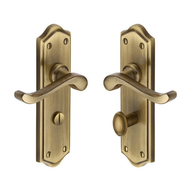 This is an image of a Heritage Brass - Door Handle for Bathroom Buckingham Design Antique Brass Finish, w4220-at that is available to order from Trade Door Handles in Kendal.