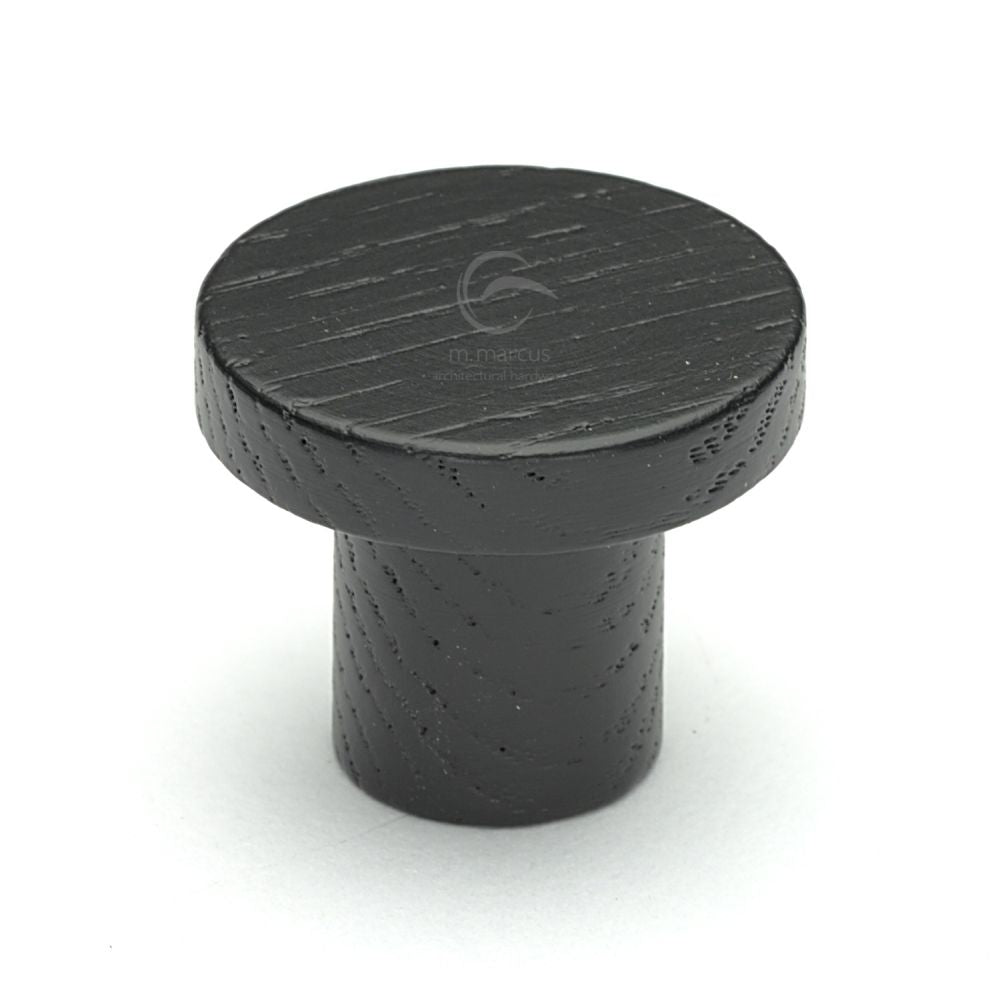 This is an image of a M.Marcus - Wooden Cabinet Knob Round Circum Design 33mm Black Ash Finish, w4470-33-ash that is available to order from Trade Door Handles in Kendal.